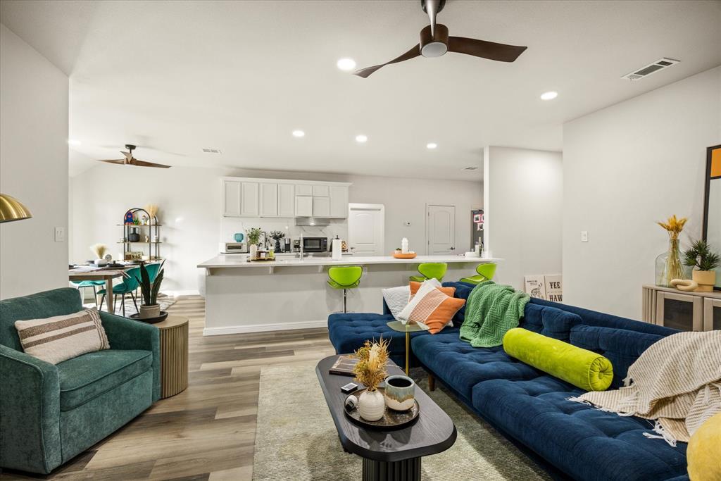 4801 West Wedgefield Road Granbury, TX 76049 - Photo 6 of 40 a living room with furniture and kitchen view
