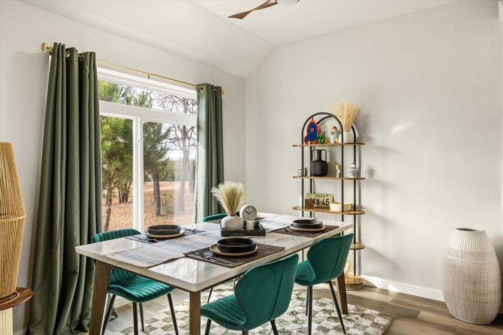 4801 West Wedgefield Road Granbury, TX 76049 - Photo 7 of 40 a view of a dining room with furniture window and outside view