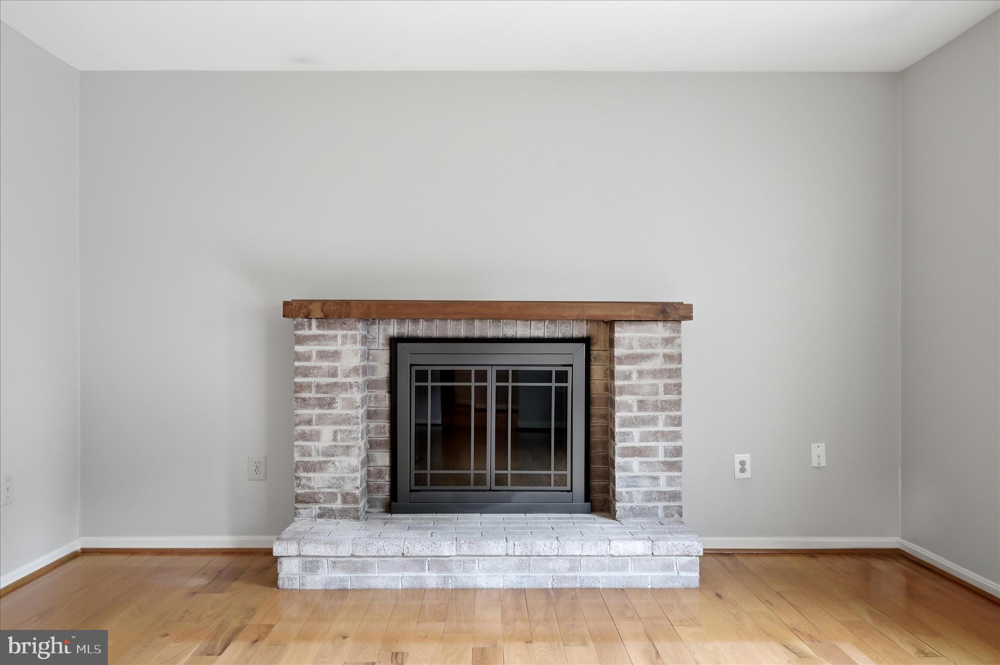 244 High Banks Road Stephenson, VA 22656 - Photo 9 of 45 a view of an empty room with wooden floor and a fireplace