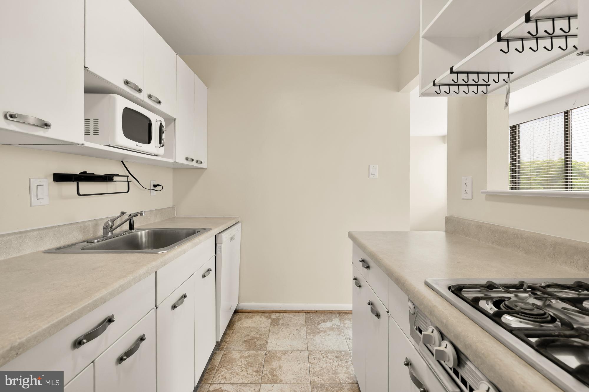 4390 Lorcom Lane, Unit 503 Arlington, VA 22207 - Photo 14 of 31 Bright and functional kitchen space.