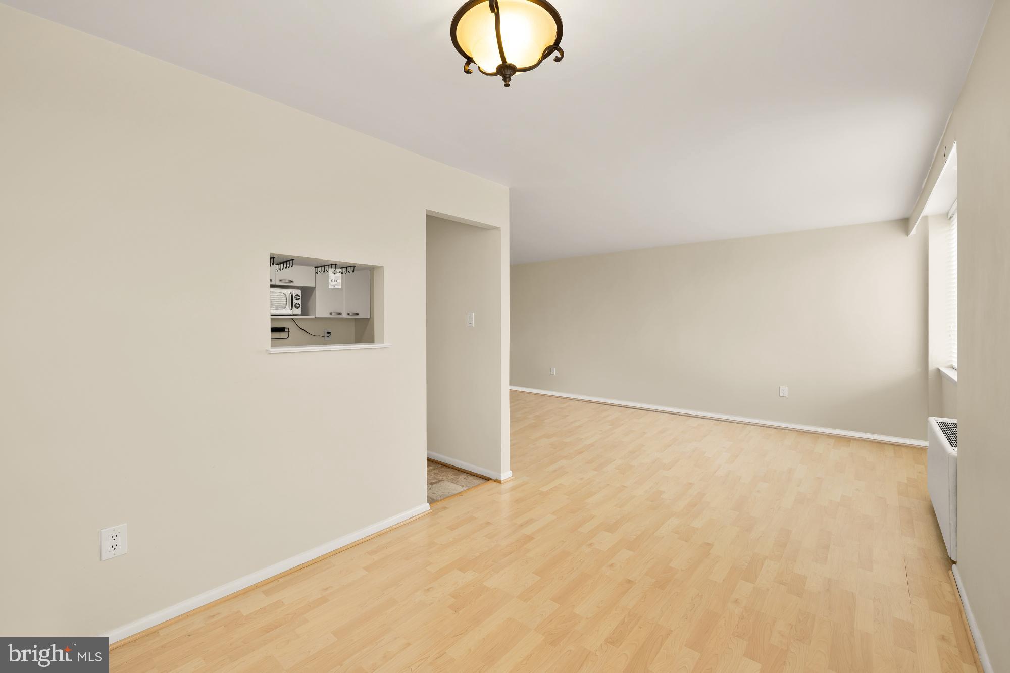 4390 Lorcom Lane, Unit 503 Arlington, VA 22207 - Photo 15 of 31 Spacious, sunlit living area awaits your touch.