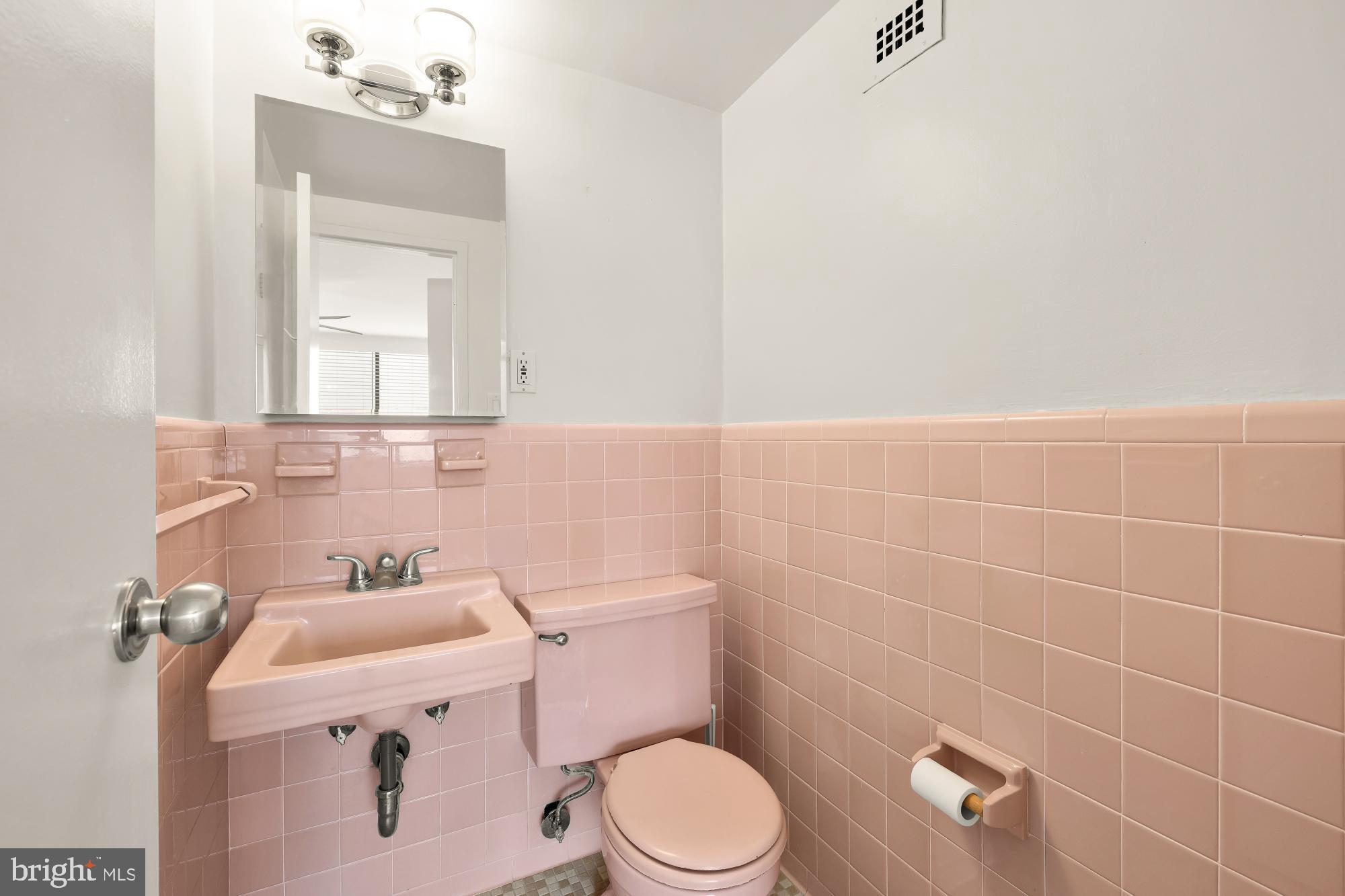 4390 Lorcom Lane, Unit 503 Arlington, VA 22207 - Photo 20 of 31 Charming retro pink bathroom oasis.