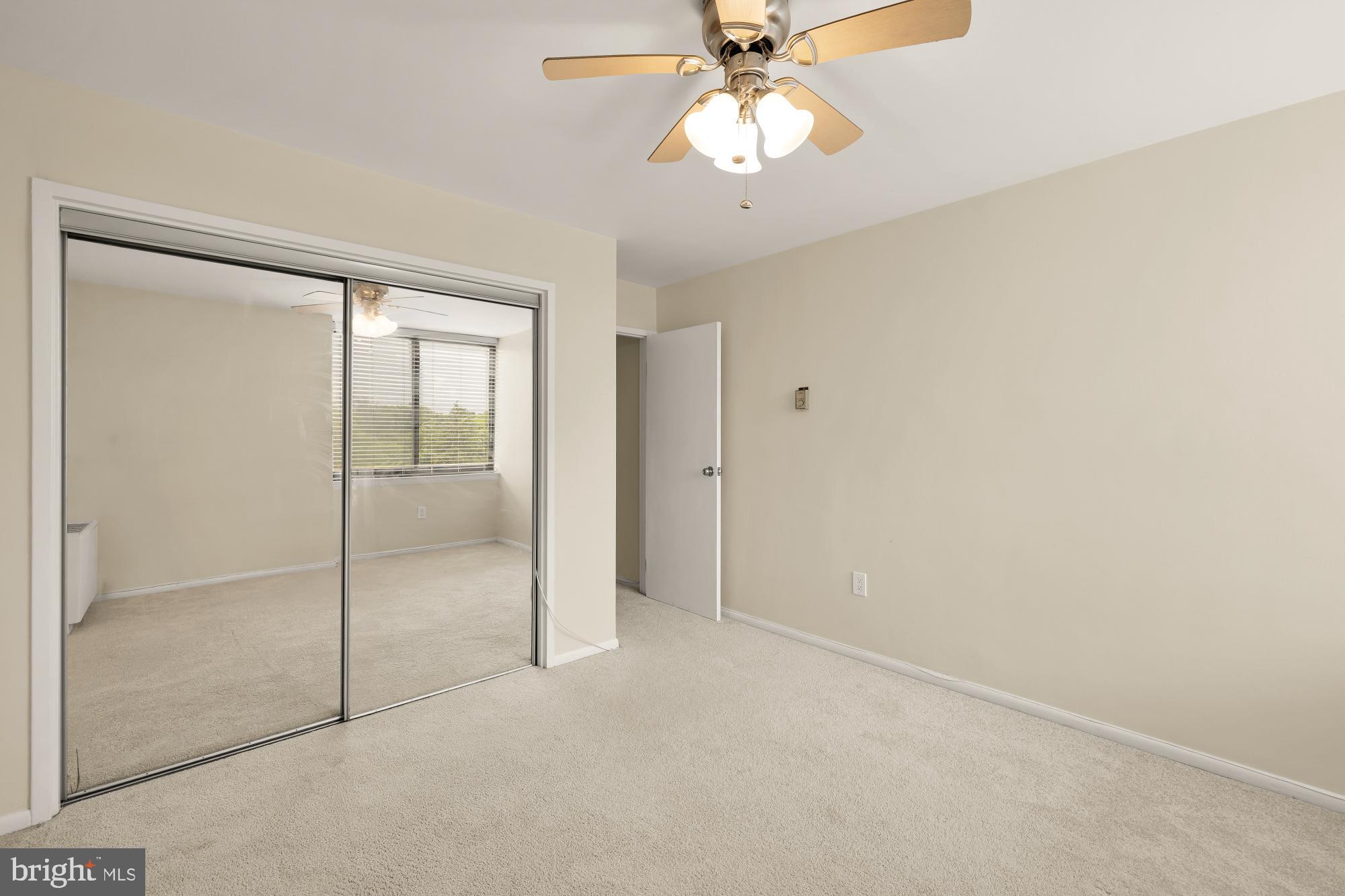 4390 Lorcom Lane, Unit 503 Arlington, VA 22207 - Photo 22 of 31 Bright and airy room with mirrored closet.