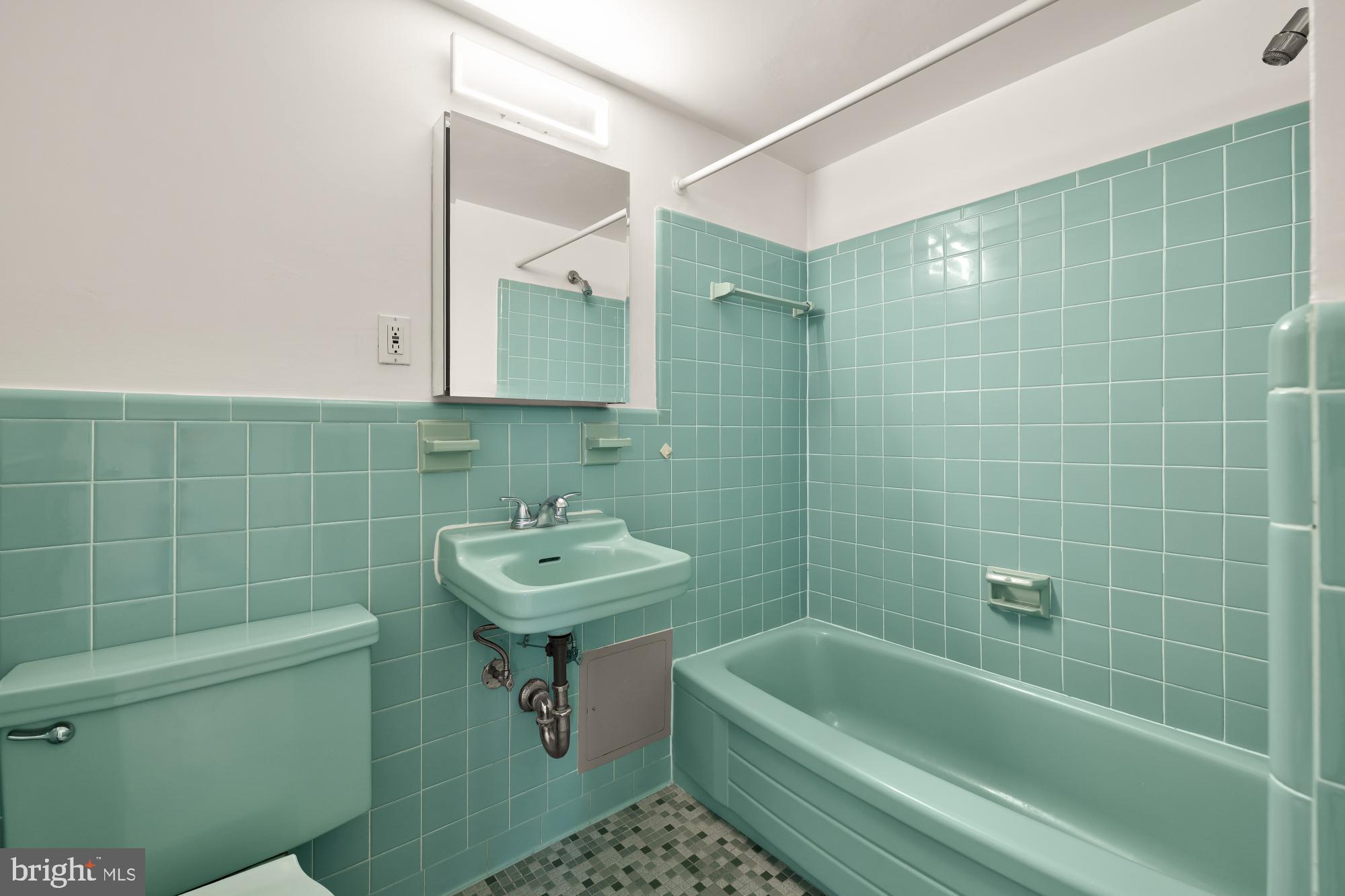4390 Lorcom Lane, Unit 503 Arlington, VA 22207 - Photo 24 of 31 Charming retro bathroom with teal tiles.