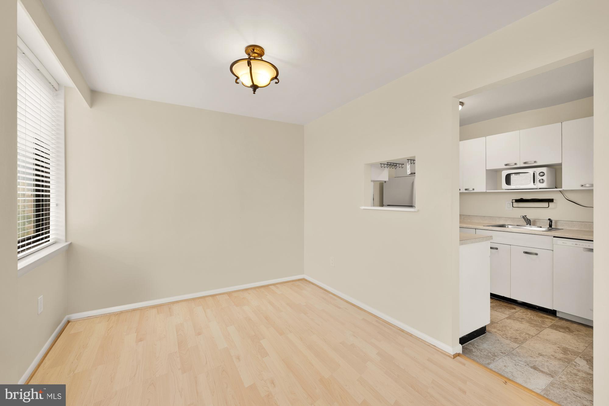 4390 Lorcom Lane, Unit 503 Arlington, VA 22207 - Photo 10 of 31 Bright, airy space with modern kitchen access.