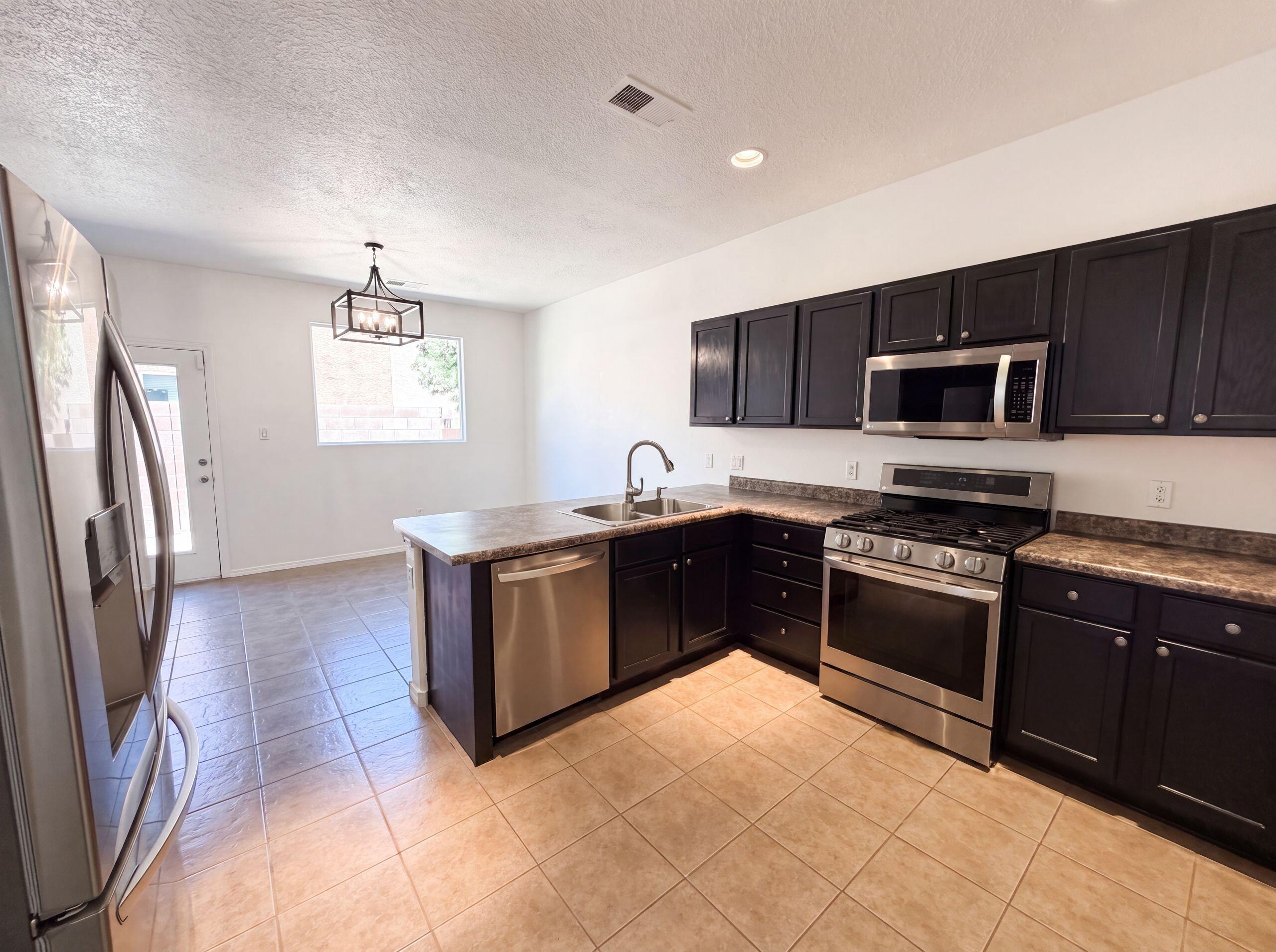 1928 Cortina Loop Southeast Rio Rancho, NM 87124 - Photo 2 of 21 Gallery Image 2