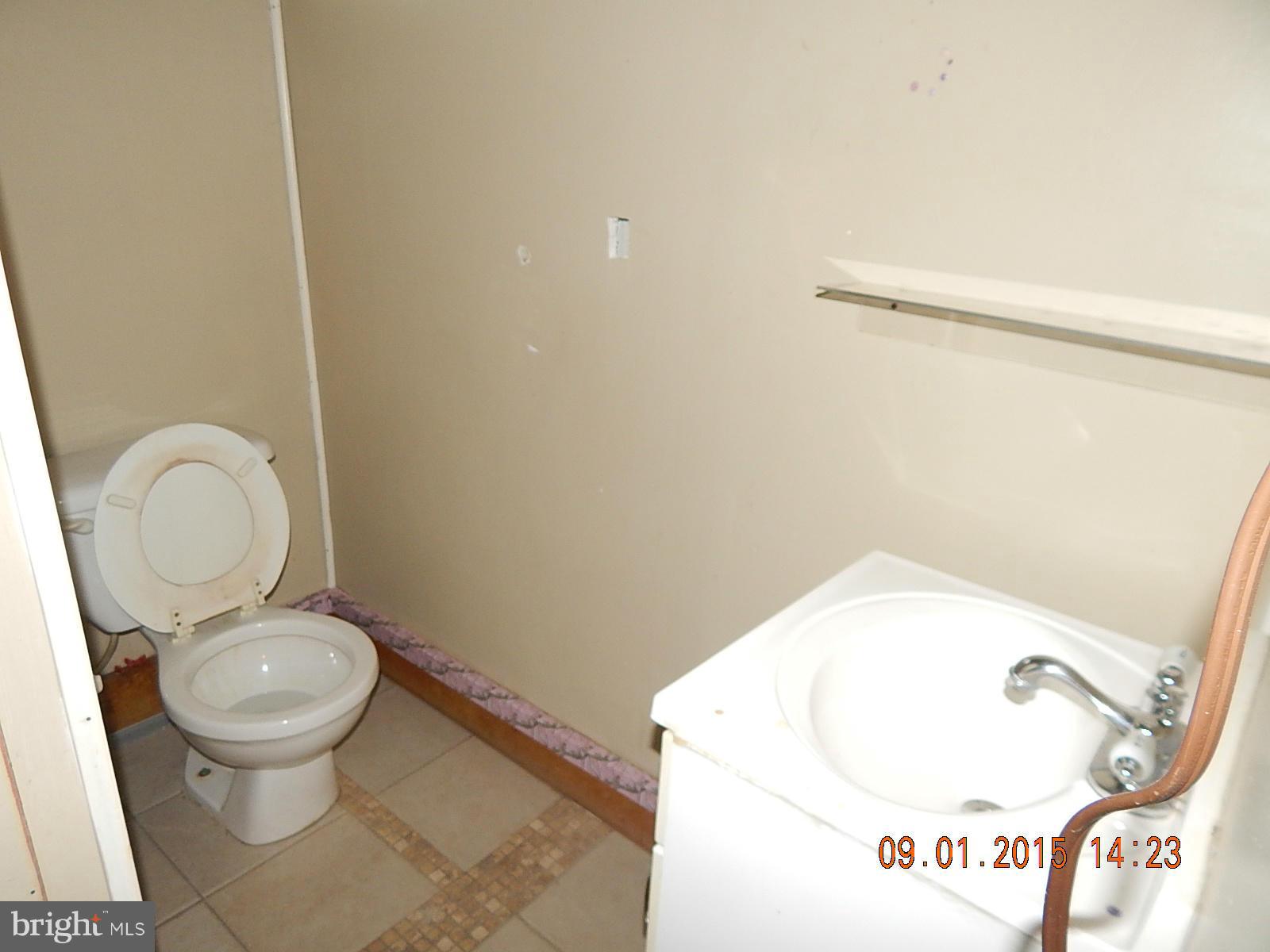 1655 Langford Road Baltimore, MD 21207 - Photo 10 of 12 a bathroom with a toilet and a sink