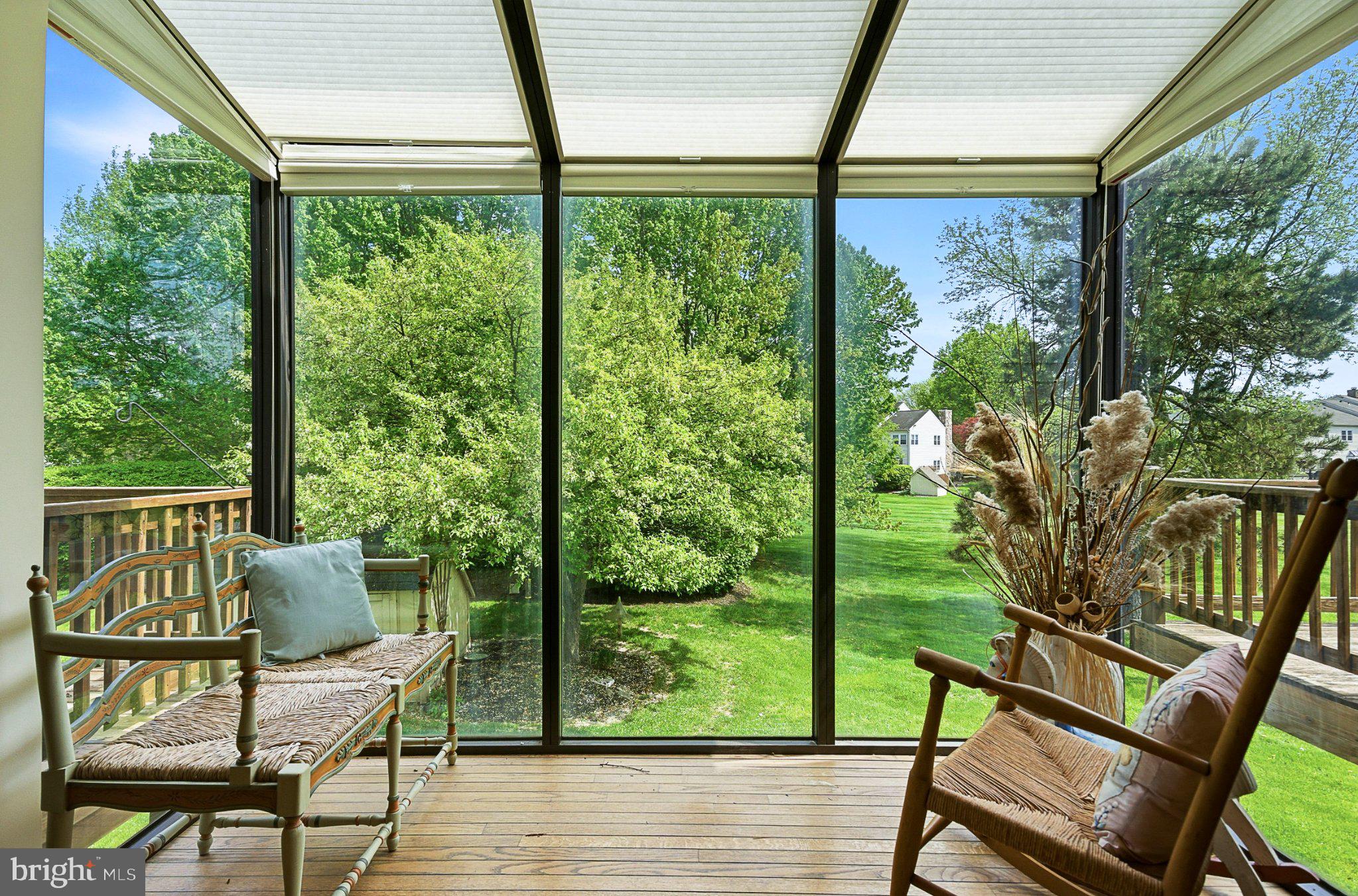 1833 Perrin Court Ambler, PA 19002 - Photo 16 of 58 Serene sunlit porch with lush views.