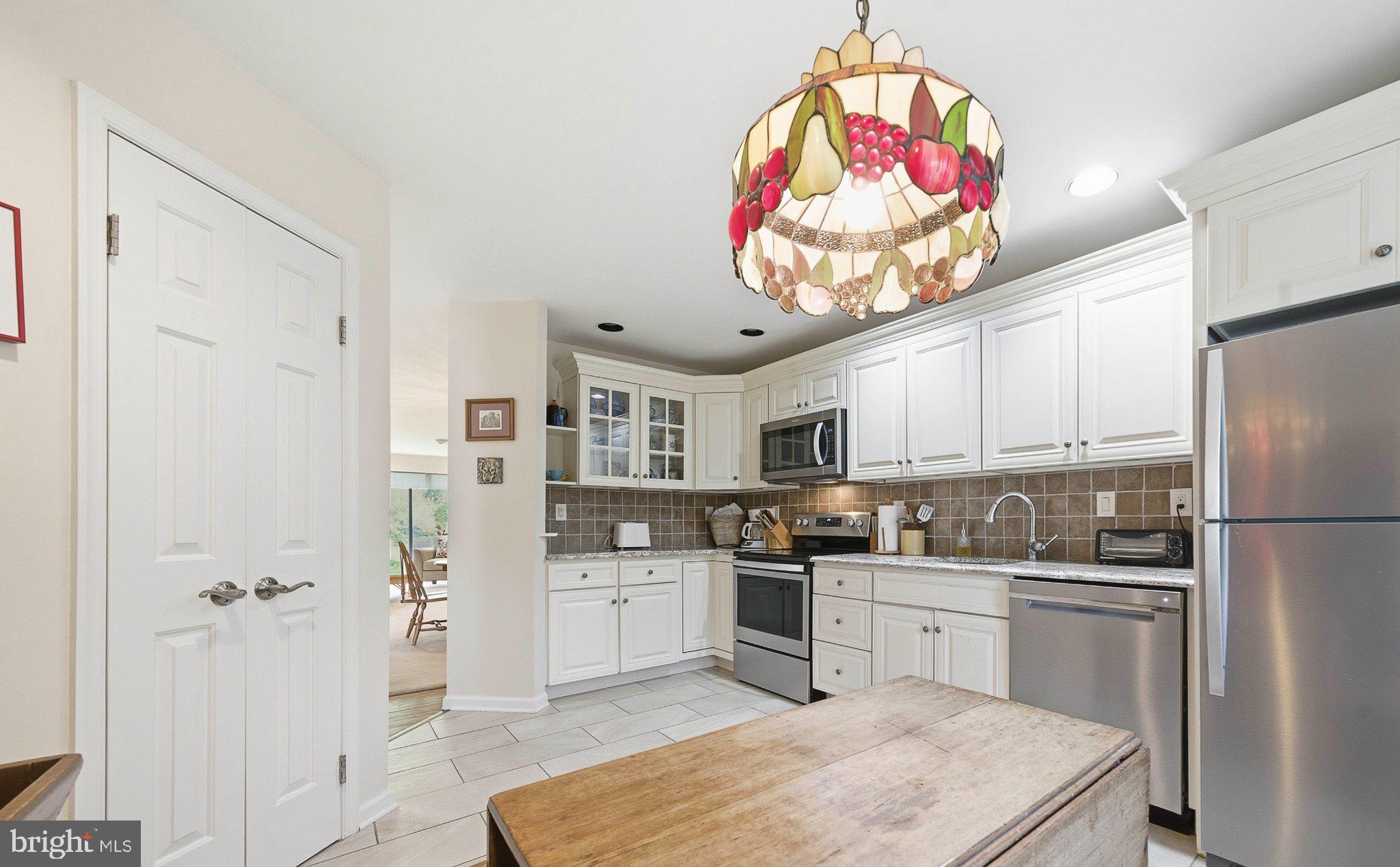 1833 Perrin Court Ambler, PA 19002 - Photo 25 of 58 Charming kitchen with vibrant chandelier.