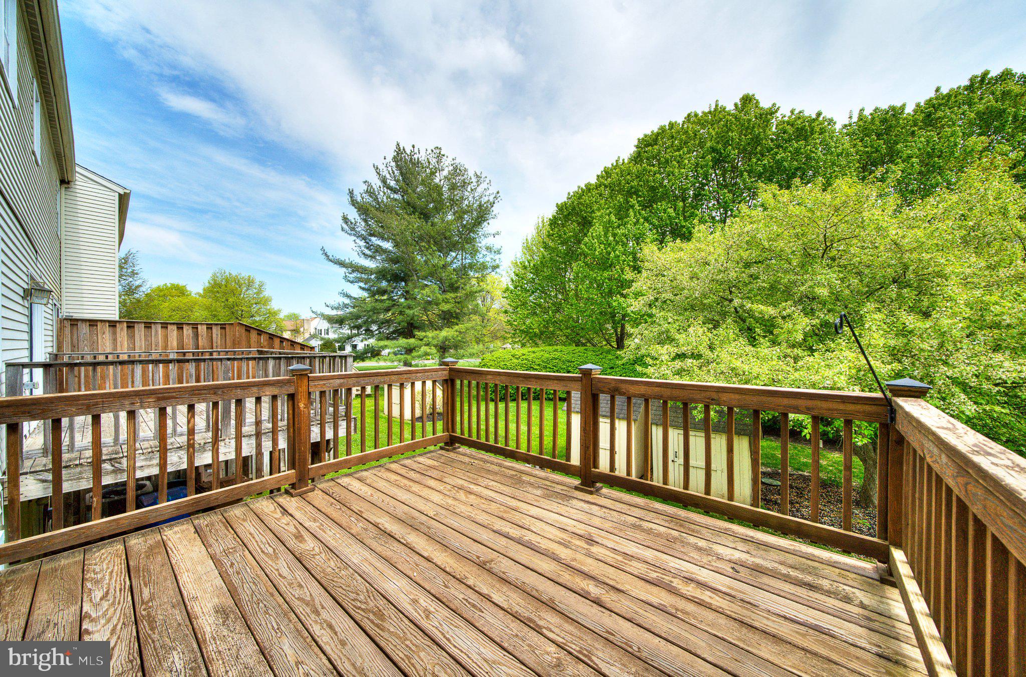 1833 Perrin Court Ambler, PA 19002 - Photo 48 of 58 Serene deck with lush greenery view.