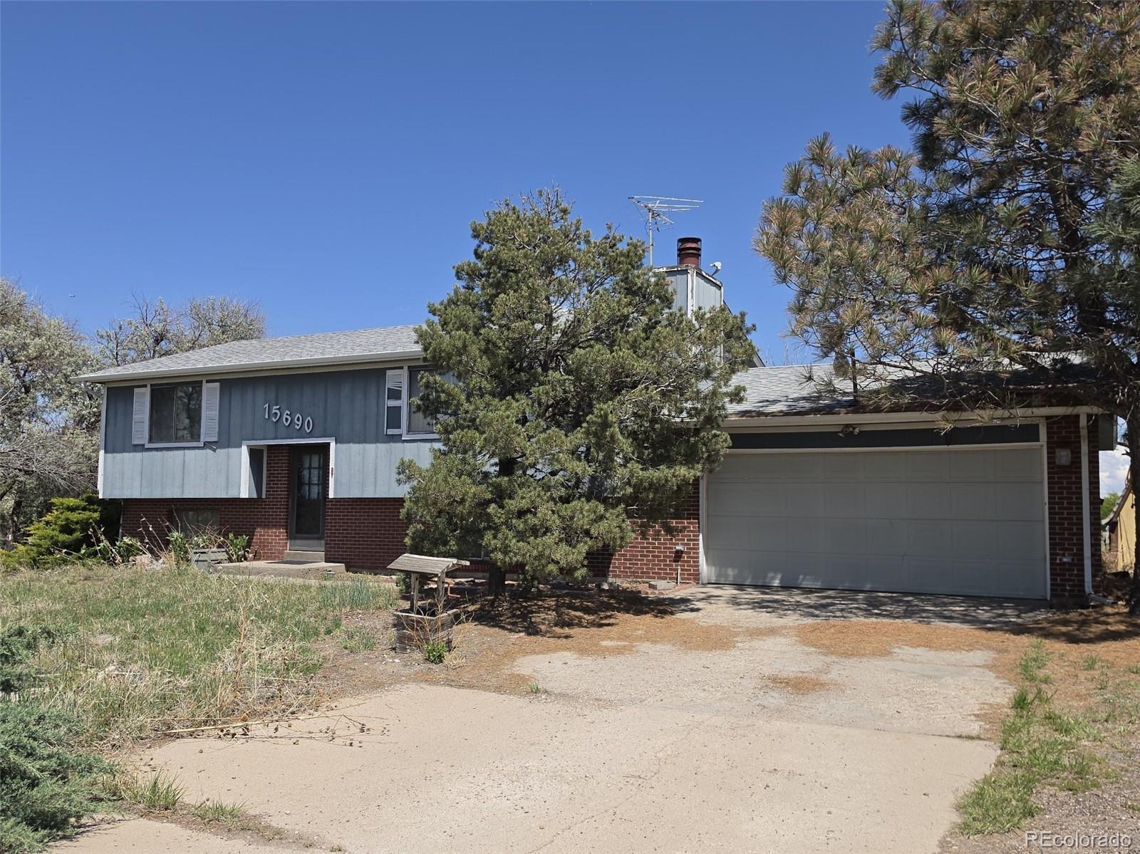 15690 Gun Club Road Brighton, CO 80603 - Photo 30 of 31 a view of a house with a yard
