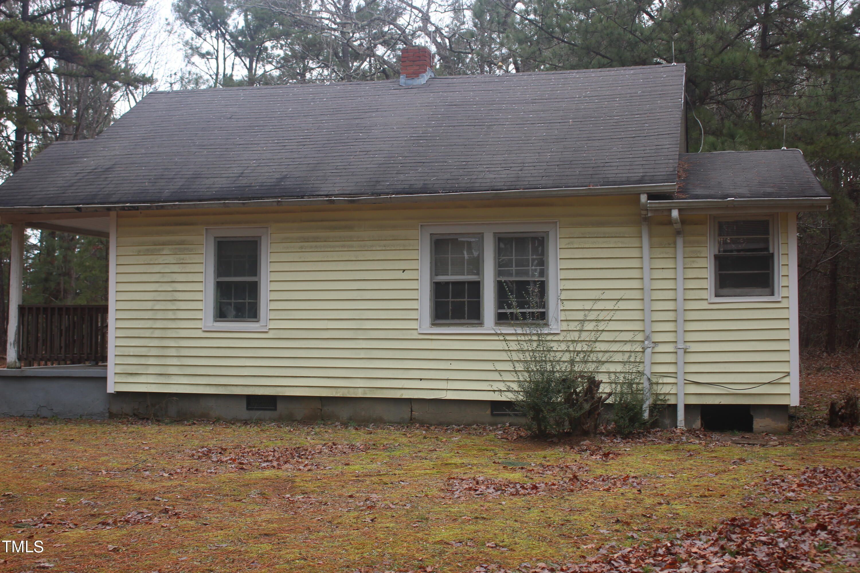 706 Manson-Drewry Road Manson, NC 27553 - Photo 2 of 4 a view of a house with a yard and wooden fence