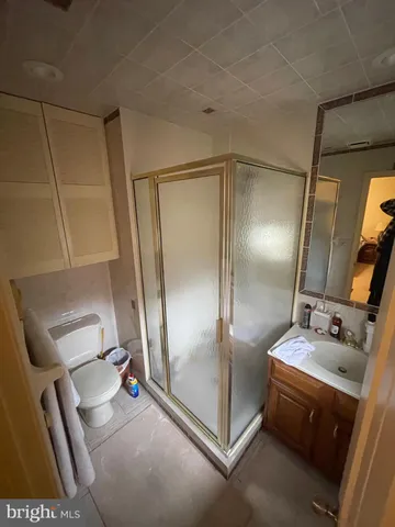 a bathroom with a double vanity sink and mirror