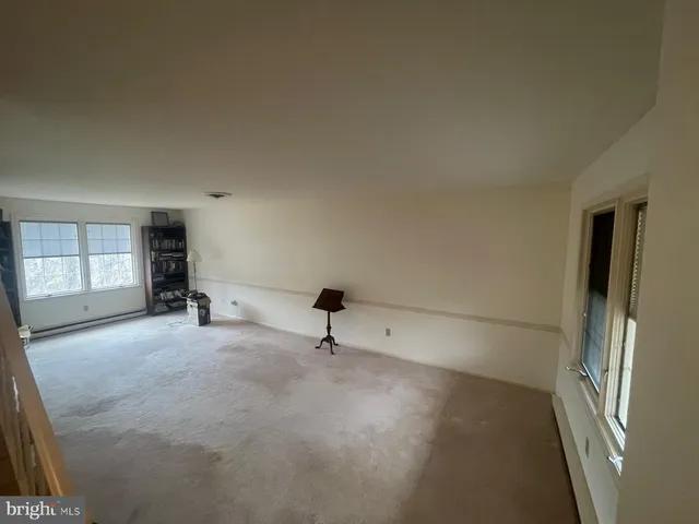 a view of empty room with windows