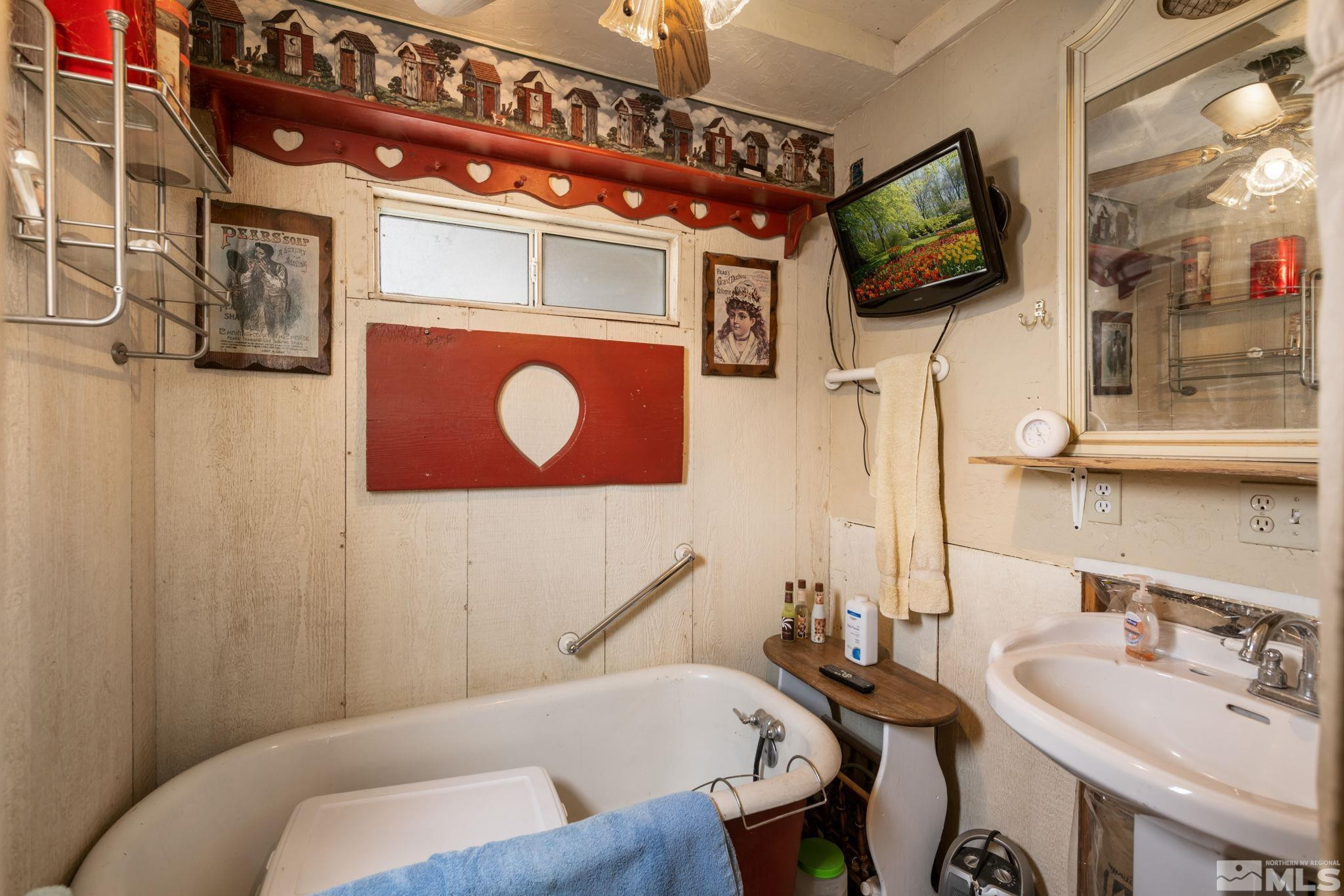 200 Reservation Road Wadsworth, NV 89442 - Photo 15 of 30 a living room with furniture and a flat screen tv