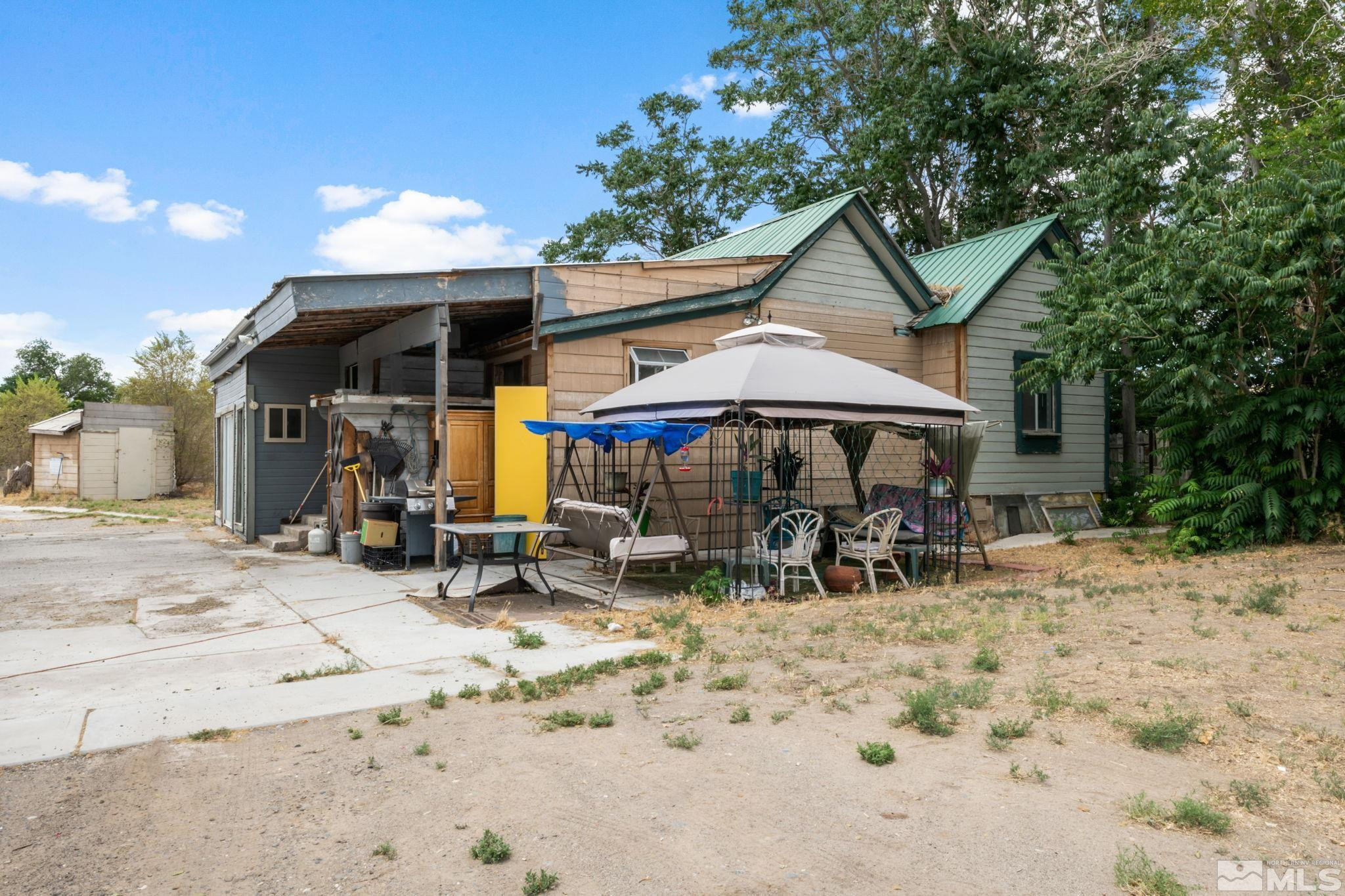 200 Reservation Road Wadsworth, NV 89442 - Photo 16 of 30 a view of a house with a patio
