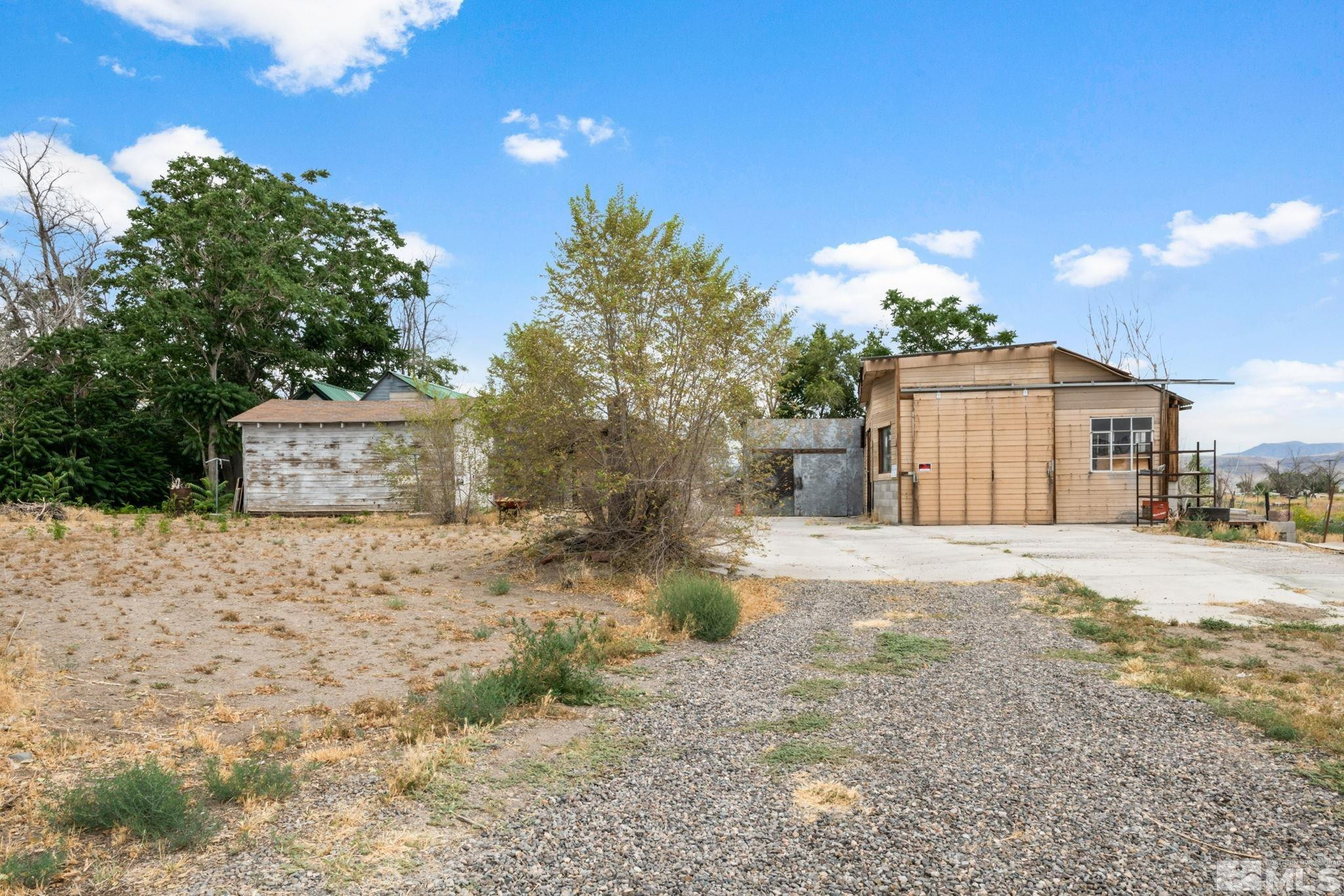 200 Reservation Road Wadsworth, NV 89442 - Photo 21 of 30 a front view of a house with a yard and garage