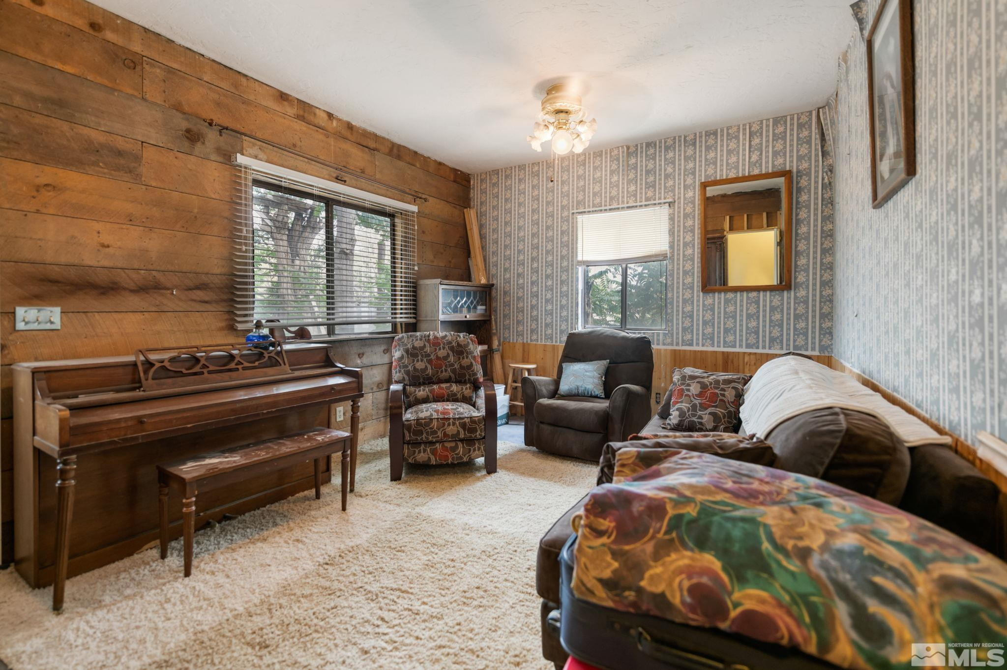 200 Reservation Road Wadsworth, NV 89442 - Photo 6 of 30 a bedroom with a bed and wooden floor