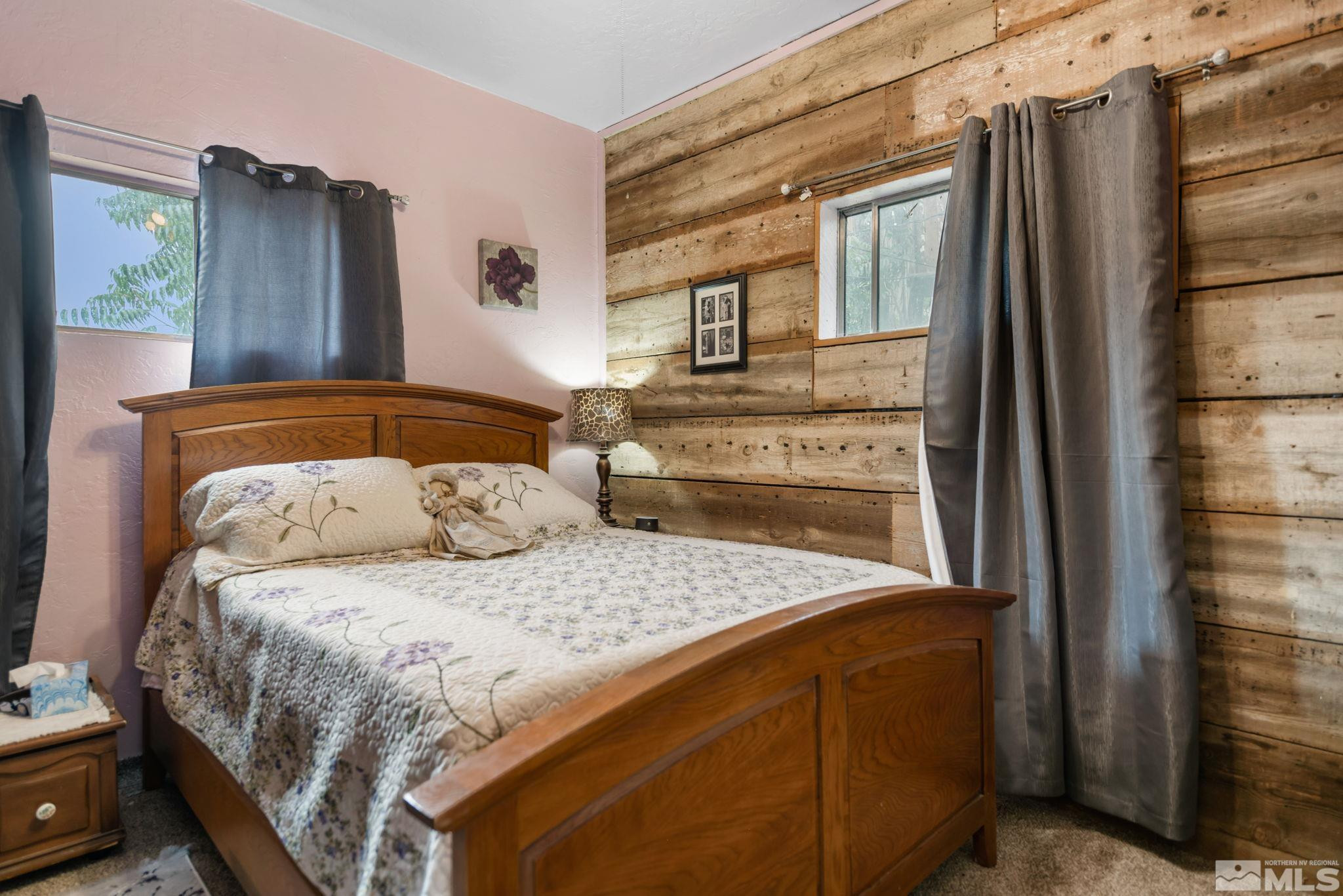 200 Reservation Road Wadsworth, NV 89442 - Photo 7 of 30 a bedroom with a large bed and a dresser