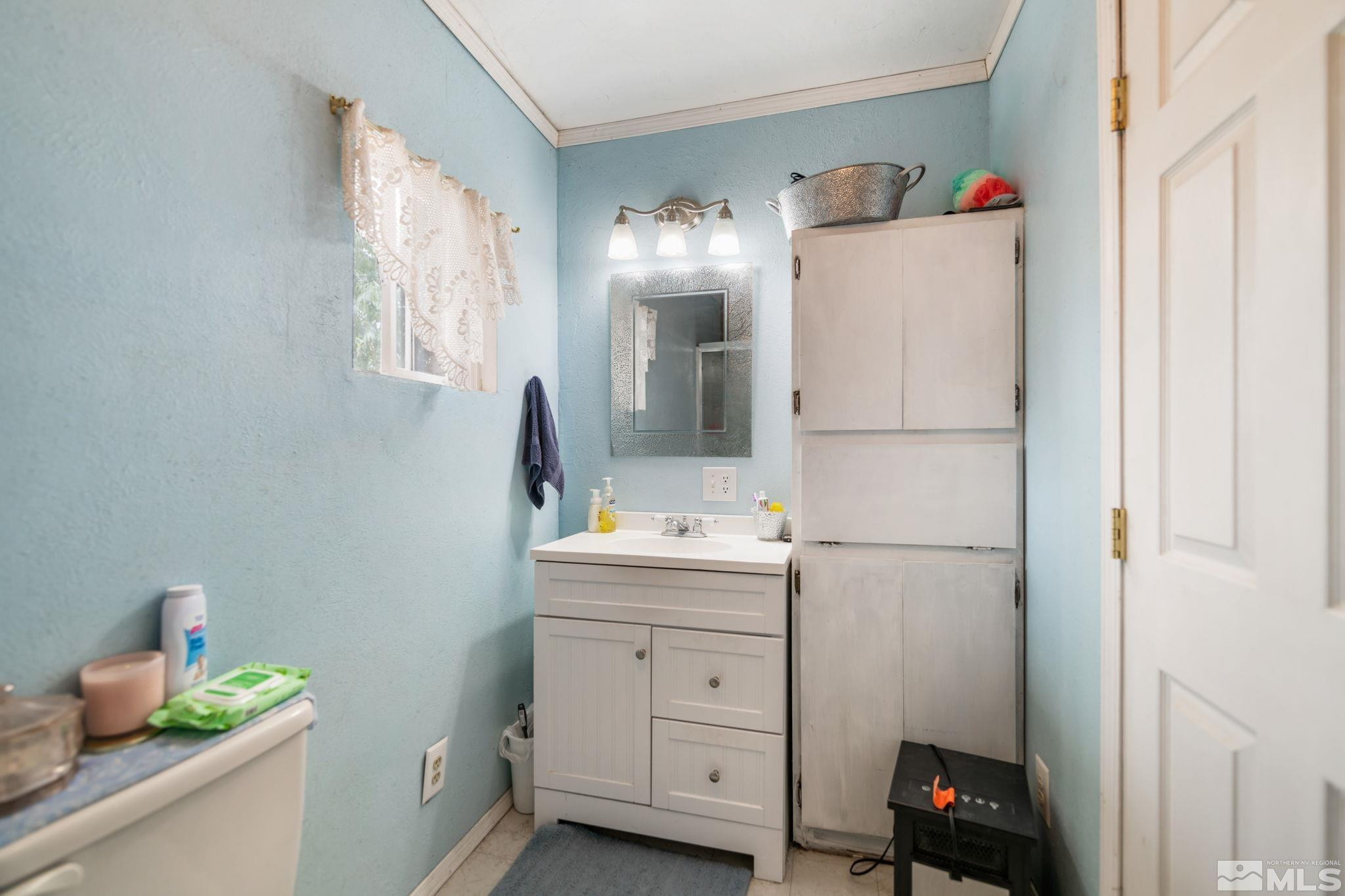 200 Reservation Road Wadsworth, NV 89442 - Photo 9 of 30 a utility room with cabinets washer and dryer