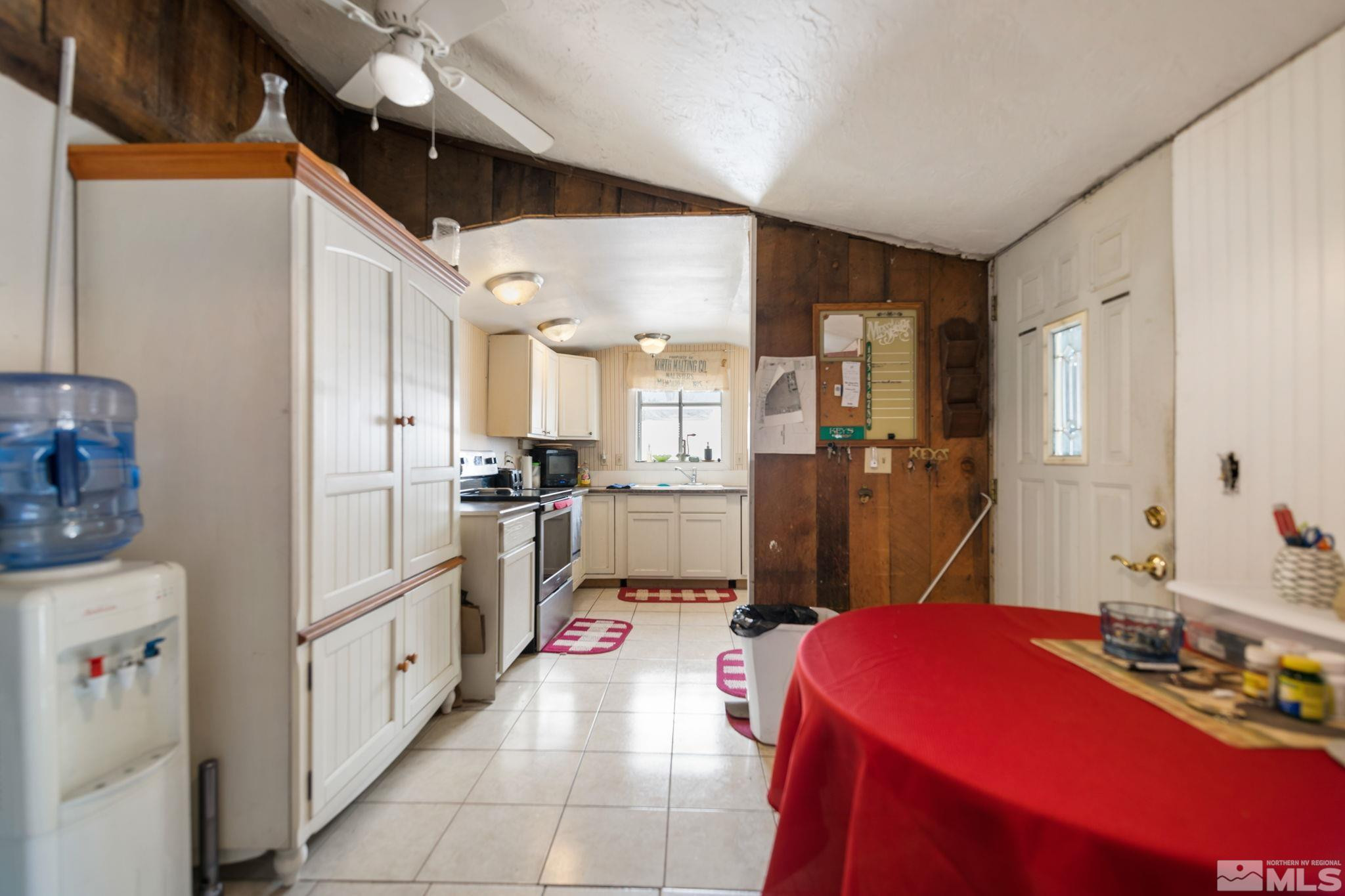 200 Reservation Road Wadsworth, NV 89442 - Photo 10 of 30 a kitchen with refrigerator and cabinets