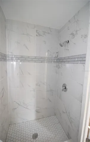 a white toilet sitting next to a white sink