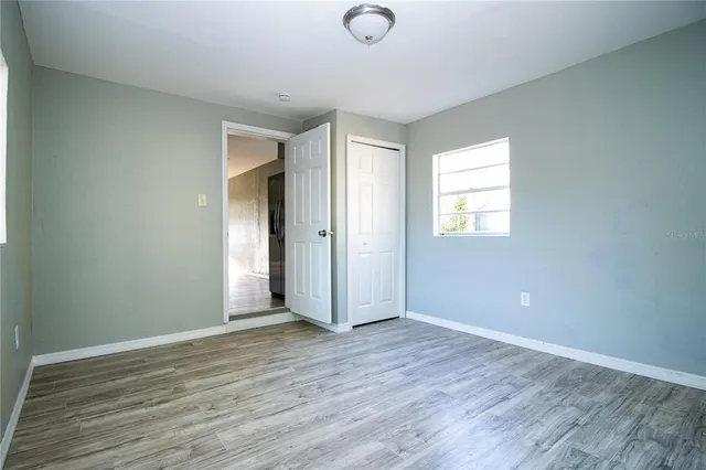 a kitchen with stainless steel appliances a stove microwave and sink