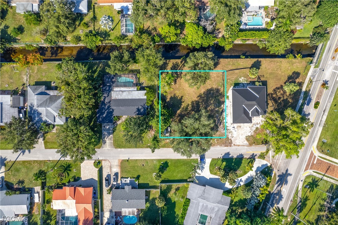 1329 Carlene Avenue Fort Myers, FL 33901 - Photo 3 of 10 an aerial view of a house with a yard and lake view