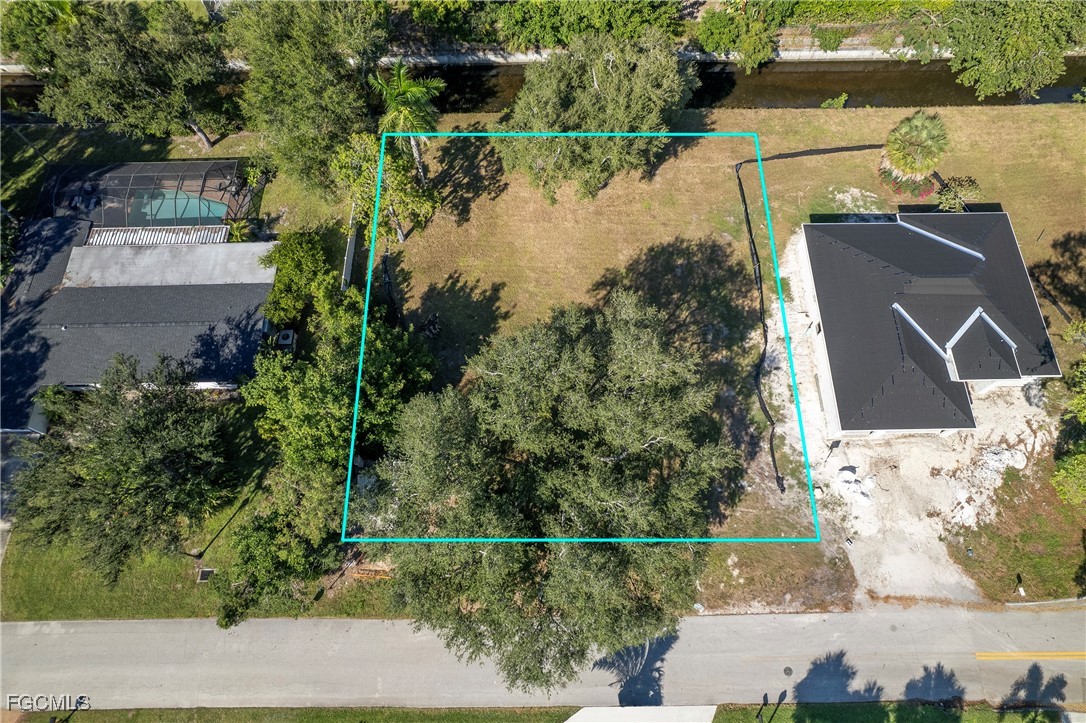 1329 Carlene Avenue Fort Myers, FL 33901 - Photo 4 of 10 an aerial view of a house with a yard and lake view
