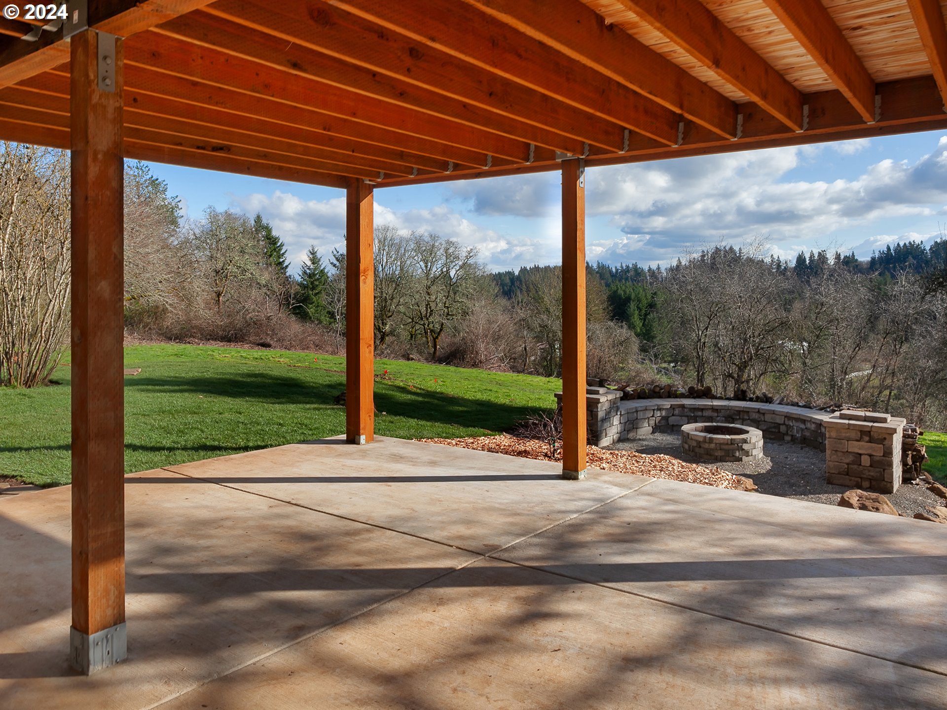 29450 Southwest Ladd Hill Road Sherwood, OR 97140 - Photo 33 of 48 a view of a patio with a table chairs and a backyard