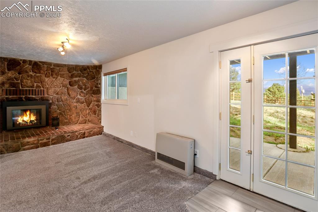 45 Barr Lake Circle Divide, CO 80814 - Photo 24 of 40 a view of an empty room with a fireplace and a window