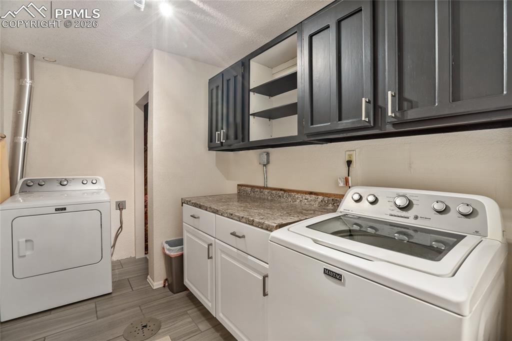 45 Barr Lake Circle Divide, CO 80814 - Photo 33 of 40 a utility room with dryer and washer
