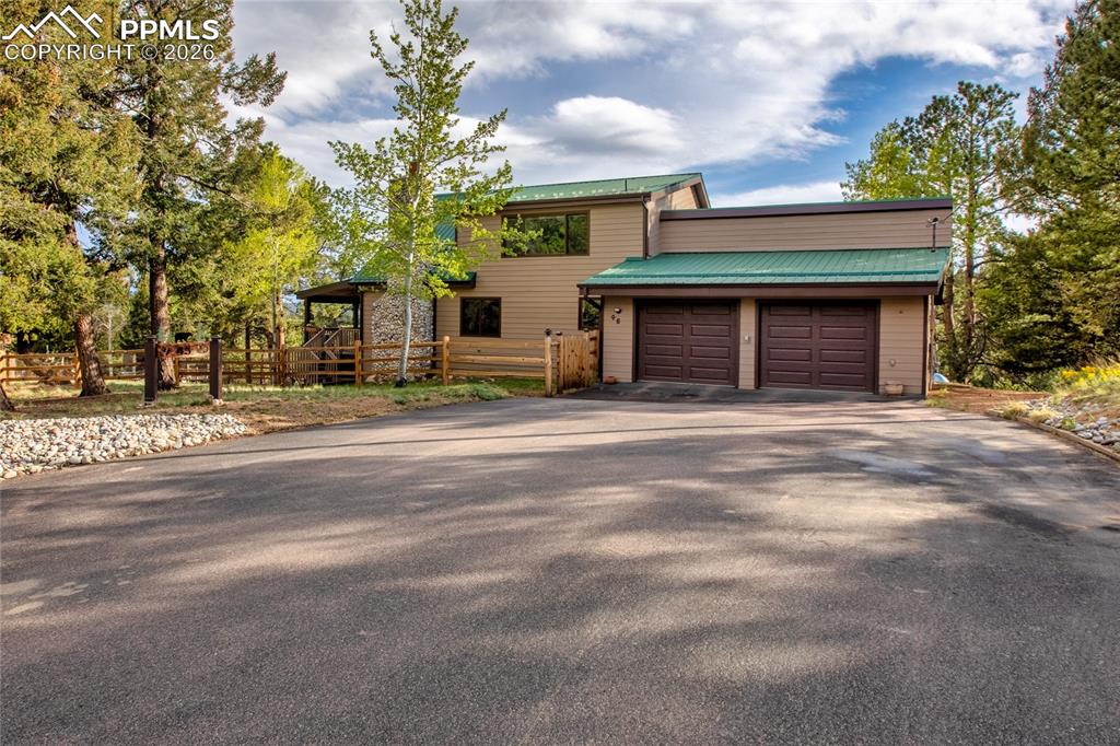 45 Barr Lake Circle Divide, CO 80814 - Photo 39 of 40 a front view of a house with a yard