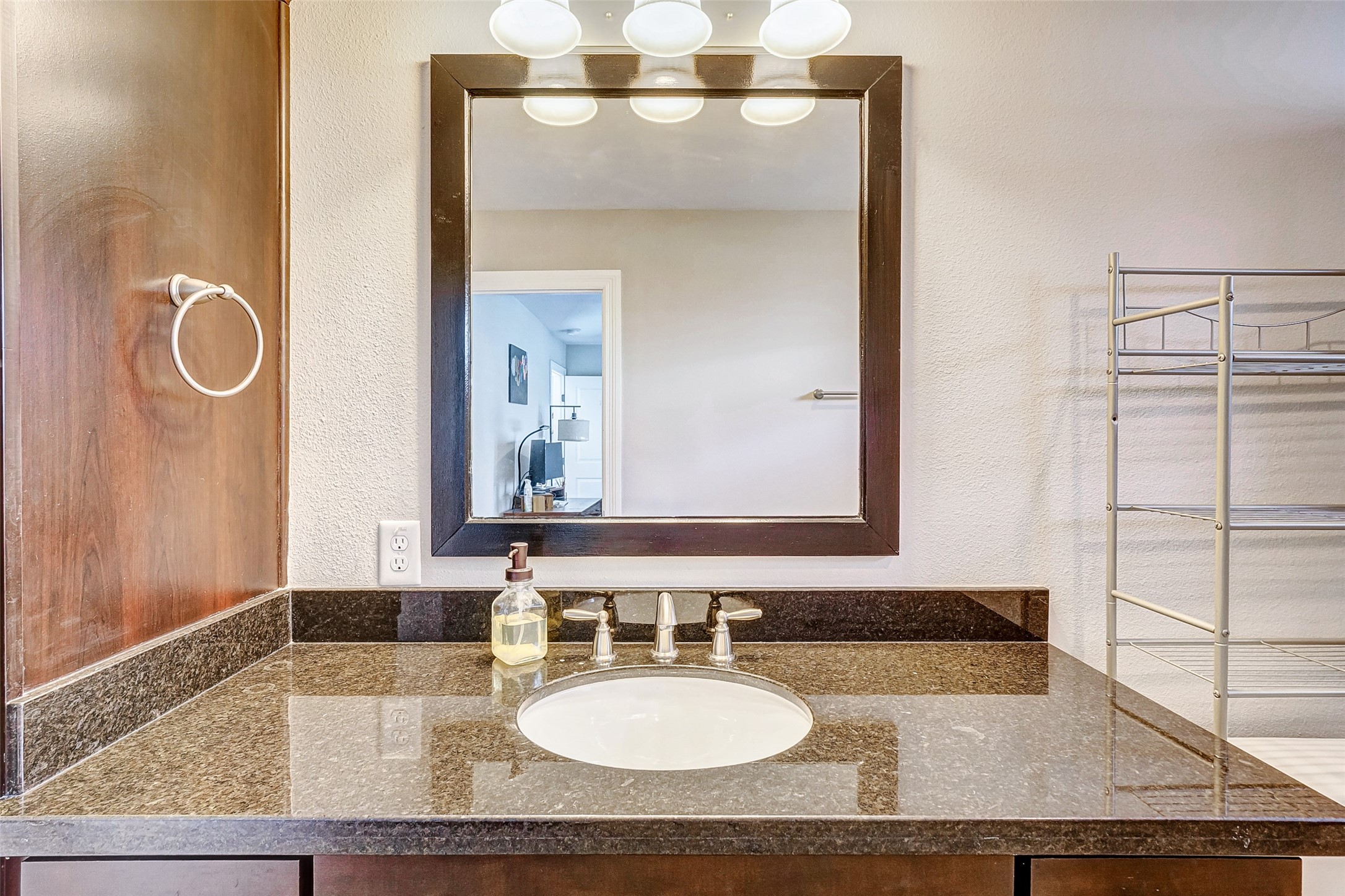 1237 West 24th Street Houston, TX 77008 - Photo 21 of 35 a bathroom with a granite countertop sink and a mirror