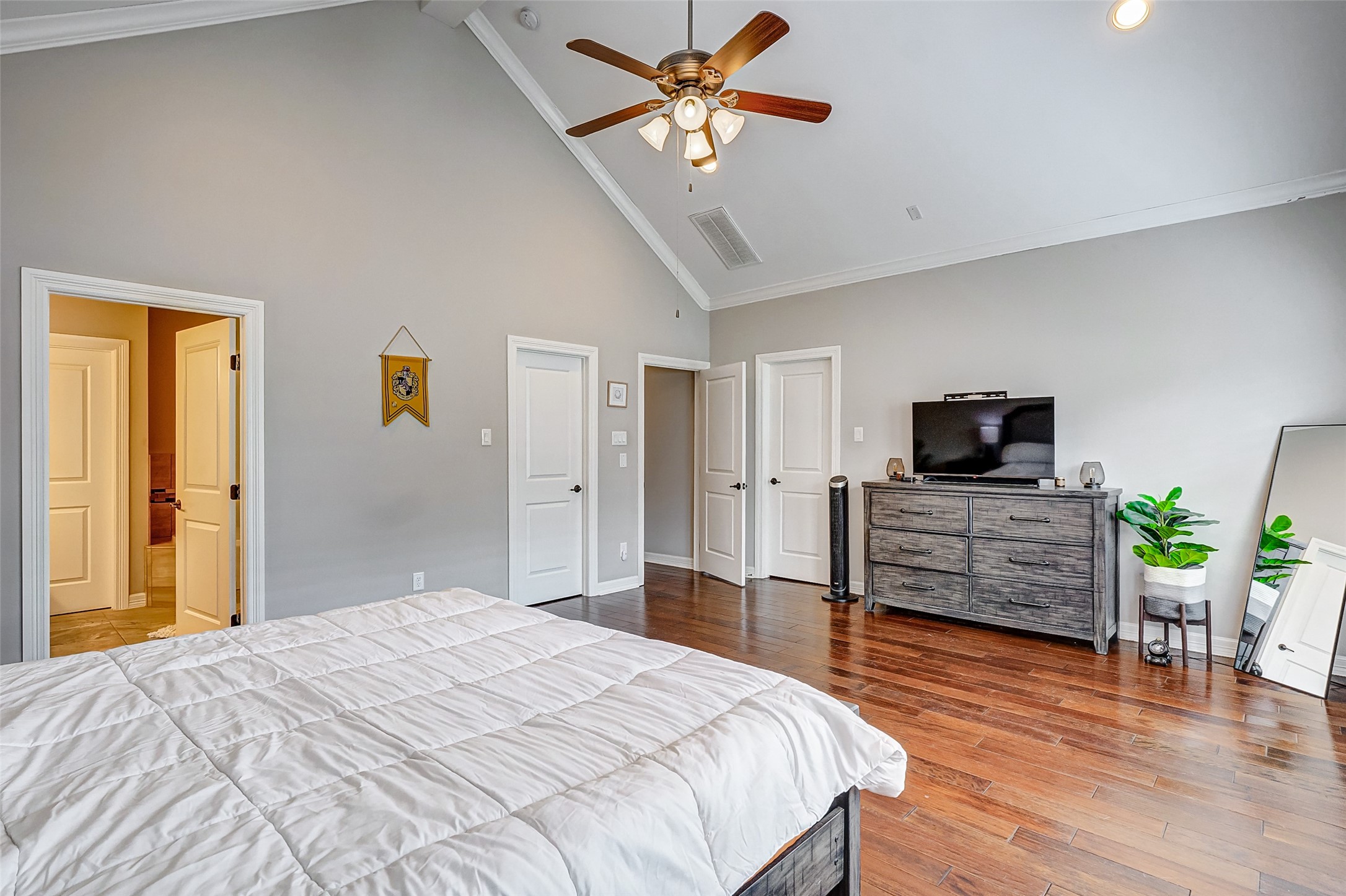 1237 West 24th Street Houston, TX 77008 - Photo 26 of 35 a bedroom with a bed and wooden floor