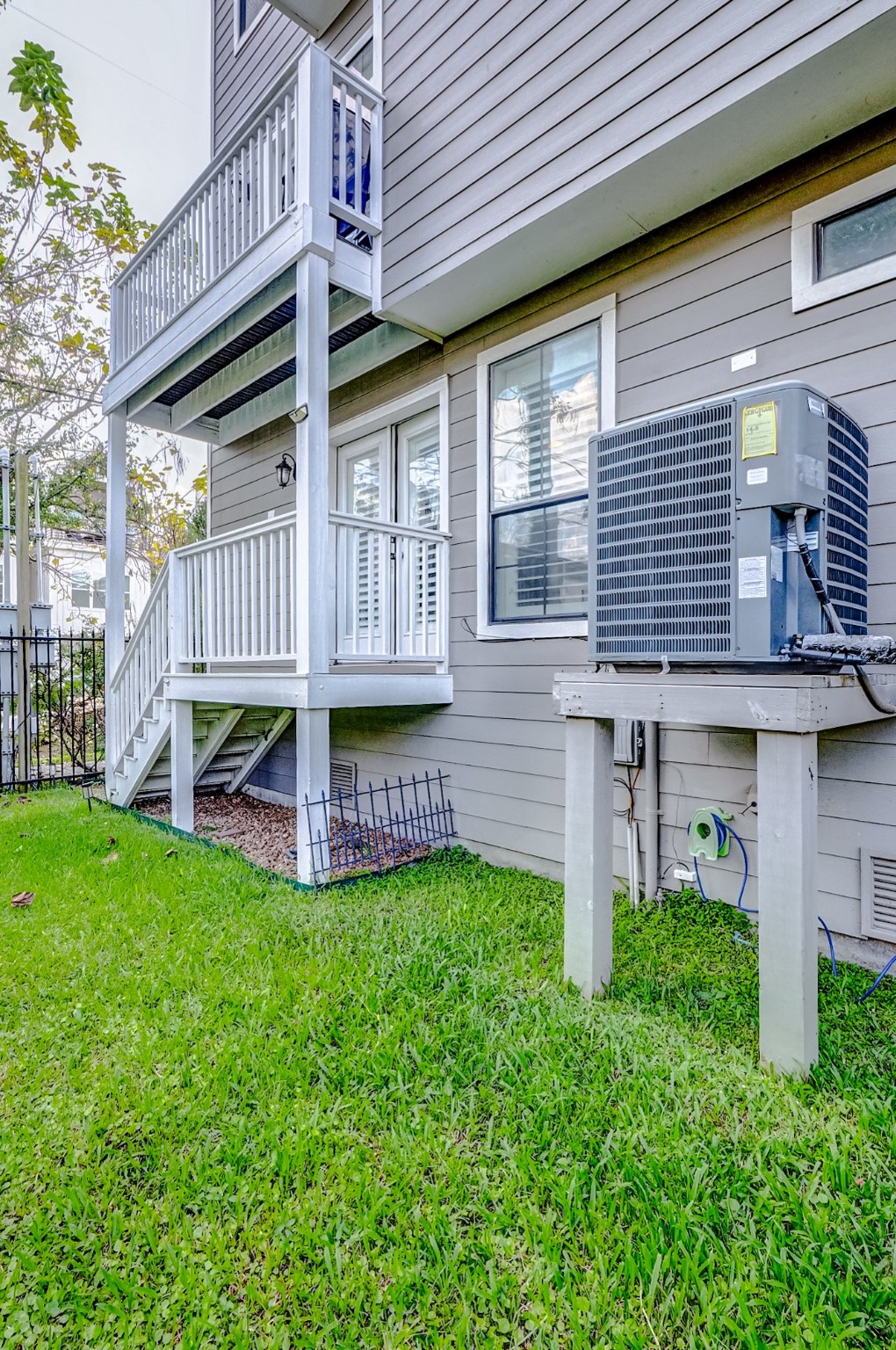 1237 West 24th Street Houston, TX 77008 - Photo 35 of 35 a front view of a house with a garden and deck
