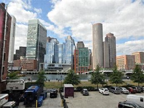 33 Sleeper Street, Unit 204 Boston, MA 02210 - Photo 3 of 4 a view of a city with tall buildings