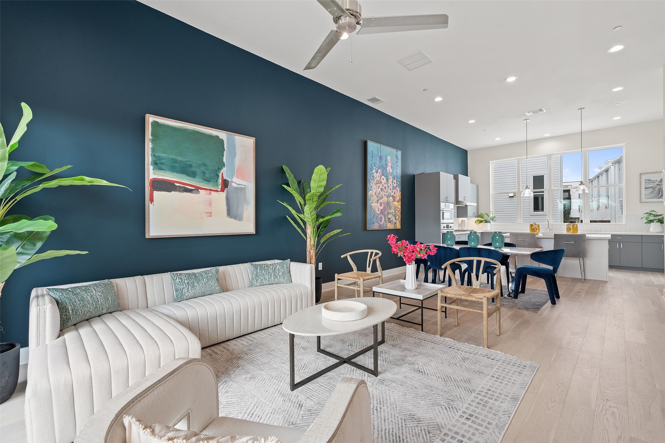 a living room with furniture and a potted plant