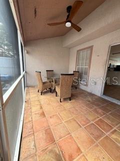 11019 Yorkshire Ridge Court Orlando, FL 32837 - Photo 13 of 15 a view of a workspace with furniture and a window