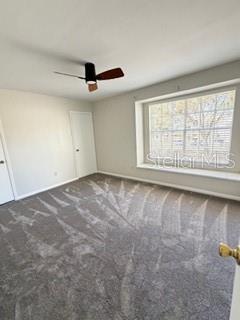 11019 Yorkshire Ridge Court Orlando, FL 32837 - Photo 9 of 15 wooden floor in an empty room with a window