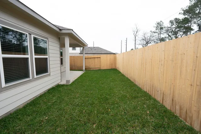 a view of a back yard of the house