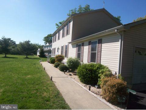 435 Pfister Road Jackson, NJ 08527 - Photo 3 of 11 a front view of a house with a yard