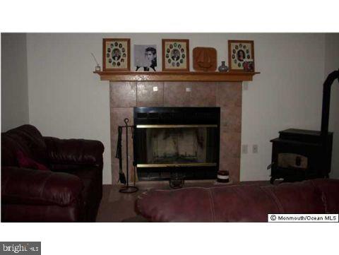 435 Pfister Road Jackson, NJ 08527 - Photo 8 of 11 a black and white photo of a fireplace