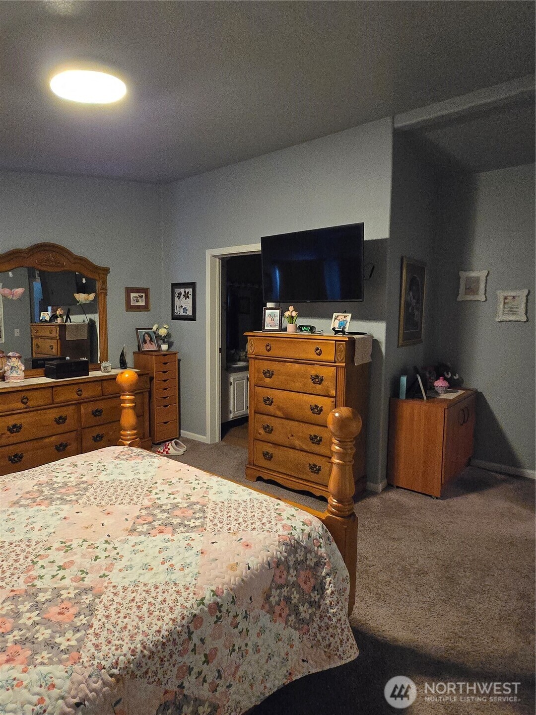 1466 Ferrier Road Winlock, WA 98596 - Photo 23 of 33 a bedroom with a bed and flat screen tv