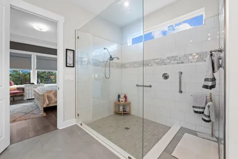 a bathroom with a tub and a shower
