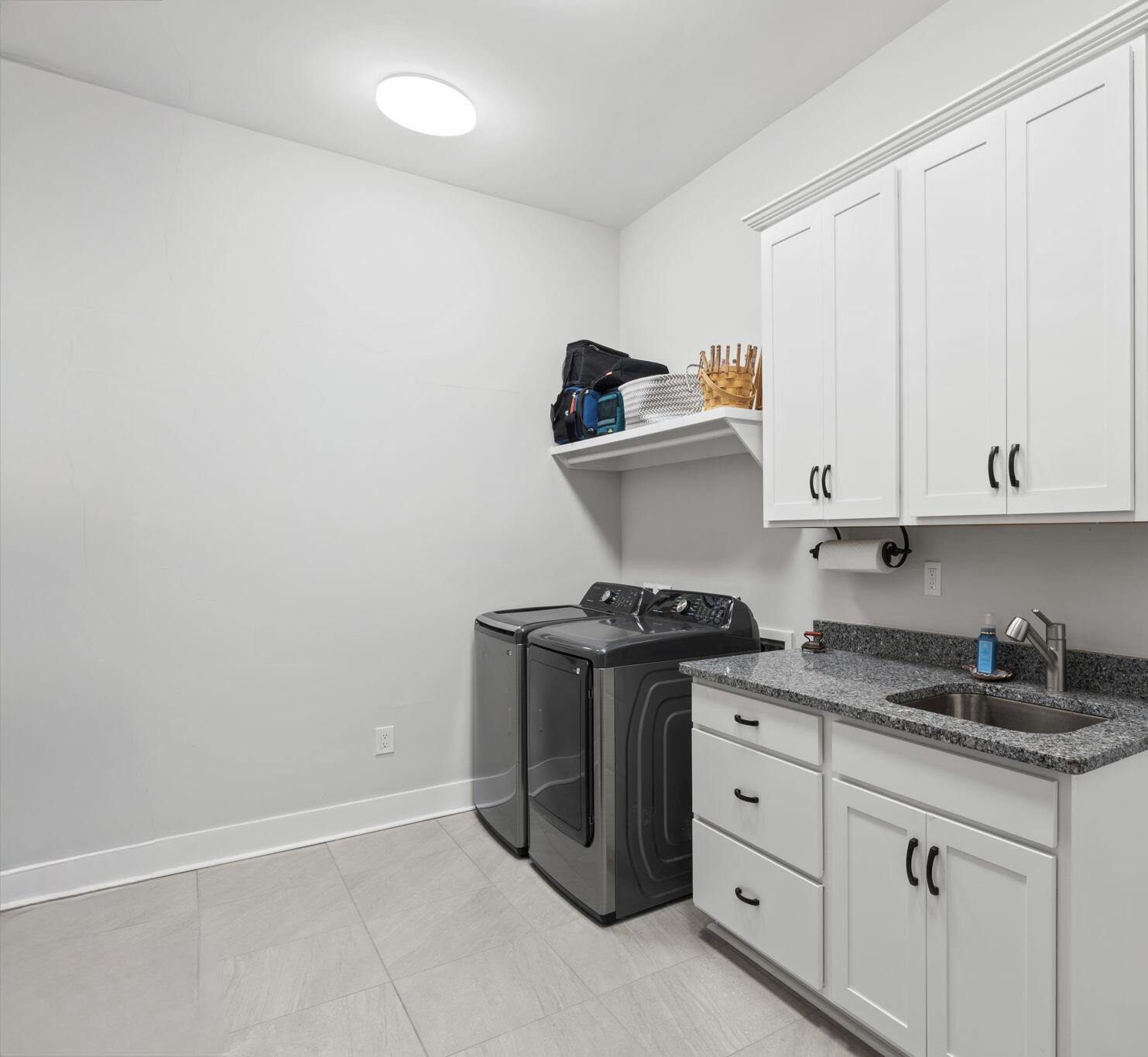 121 West Lafayette Rd Inlet Beach Inlet Beach, FL 32461 - Photo 28 of 41 a kitchen with granite countertop white cabinets and stainless steel appliances