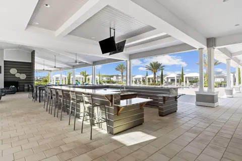 a living room with lots of furniture and a large window