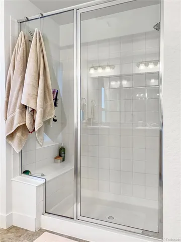 a bathroom with a shower and a tub