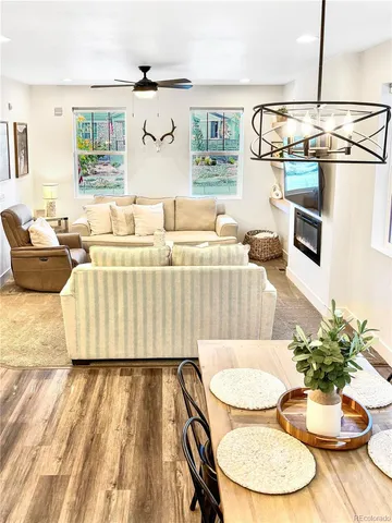a living room with furniture and a table