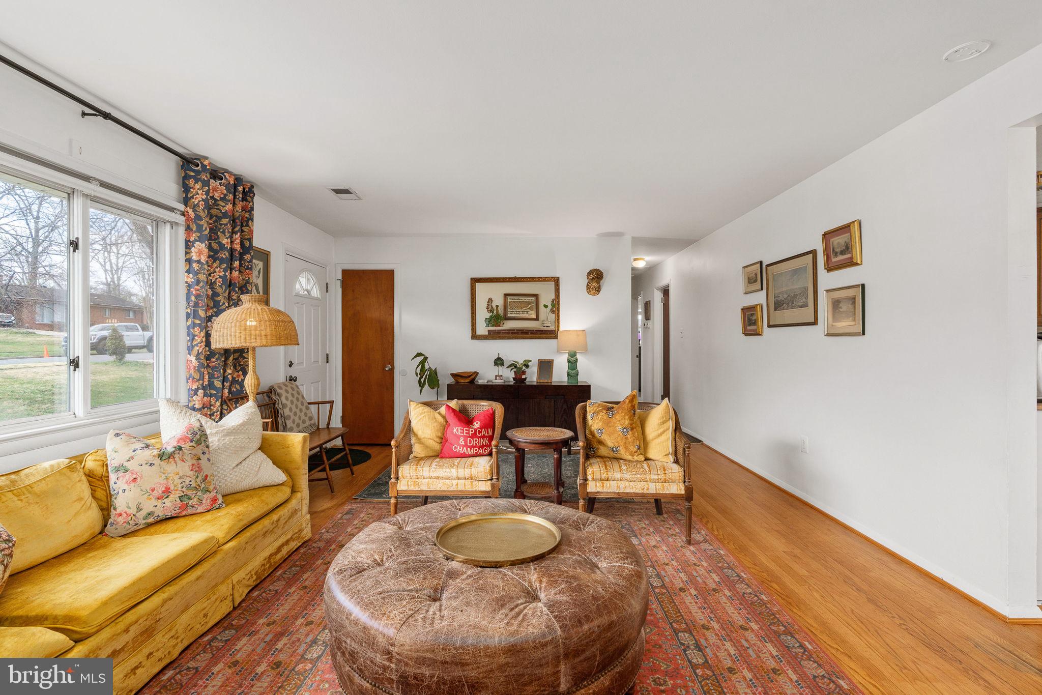6714 Ruskin Street Springfield, VA 22150 - Photo 13 of 63 a living room with furniture and a large window